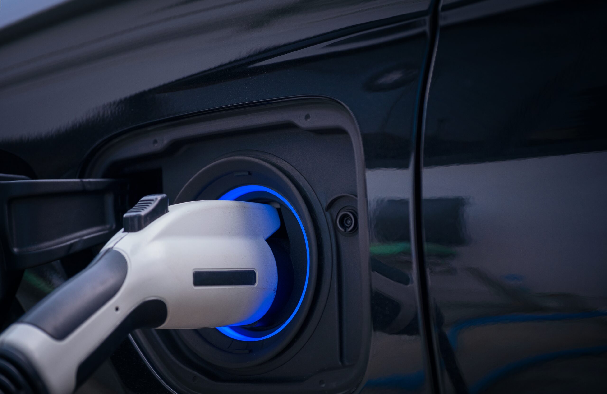 charging modern electric car battery on the street 2026 03 16 03 25 48 utc